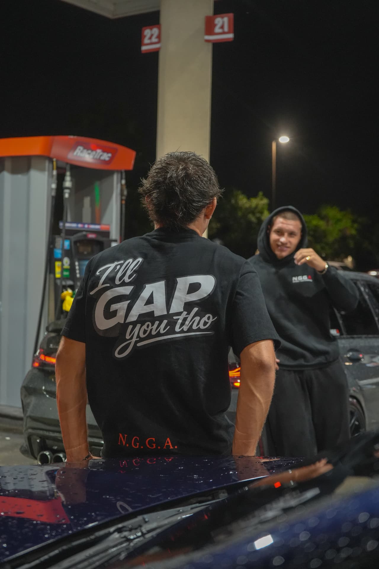 NGGA streetwear at a nighttime gas station meet